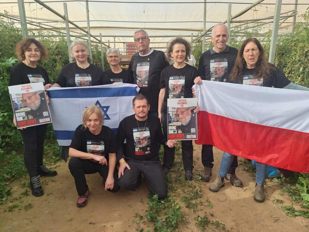 Volunteers wearing T-shirt featuring hostage Alex Dancyg