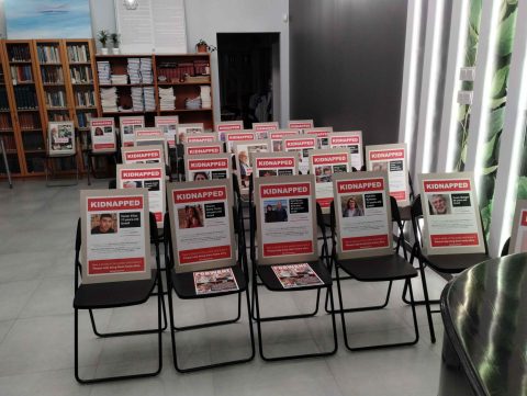 Beit Polska filled synagogue seats with posters for kidnapped Israeli individuals 3